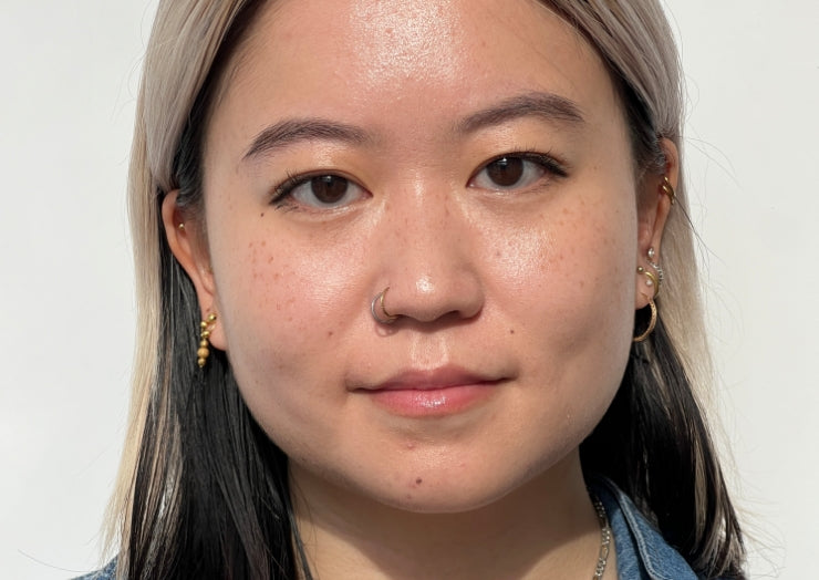 Portrait of a model wearing puppy eyeliner makeup on a white background