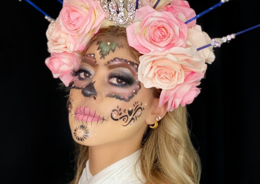 Livette Ruvalcaba wears Catrina Day of the dead makeup on a black background.