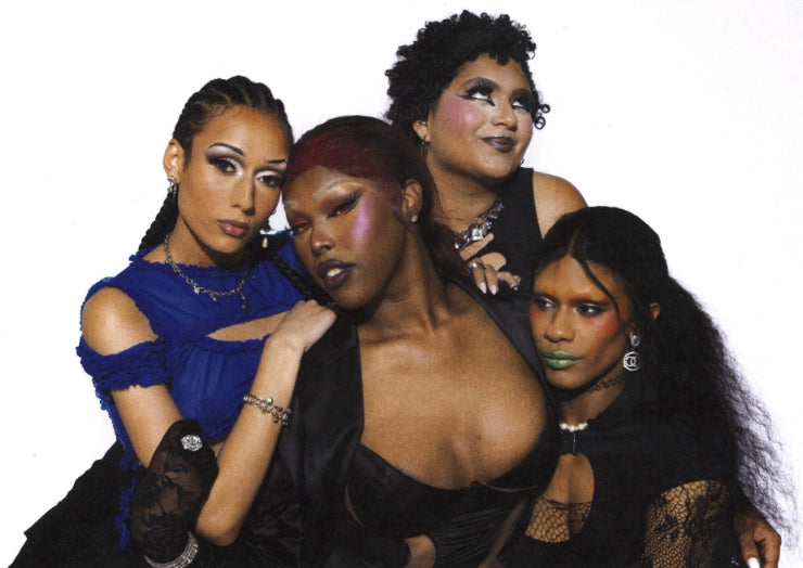 Haus of Telfar members Niala, Symone, Arie, and Iris posed together against a white background.