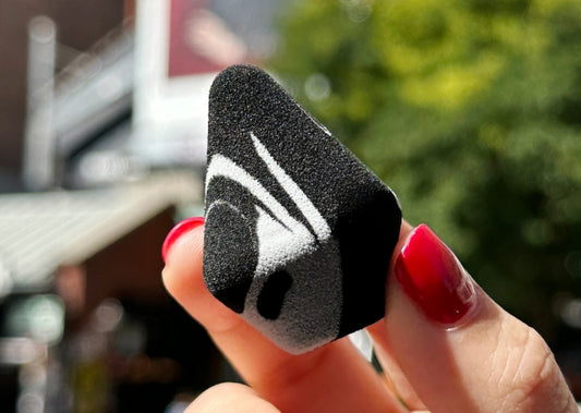 Hand holding Milk Makeup Prism Sponge